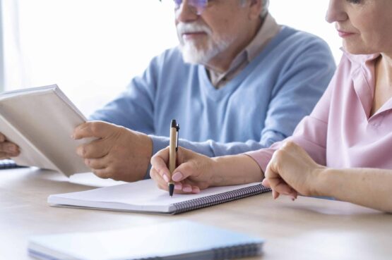 close-up-senior-couple-while-learning