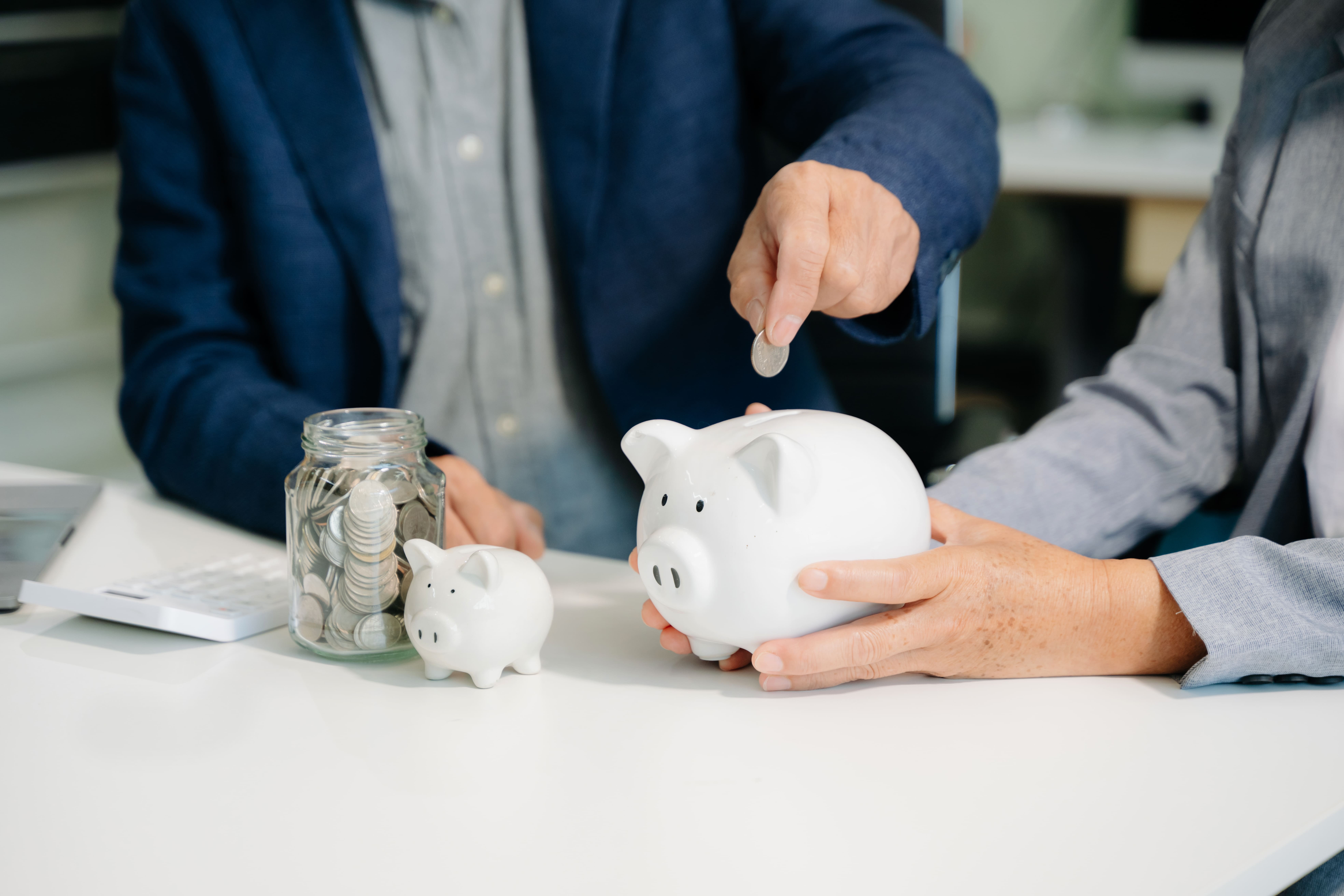 business-team-holding-coins-putting-in-glass-with-2025-06-30-21-01-53-utc (1)